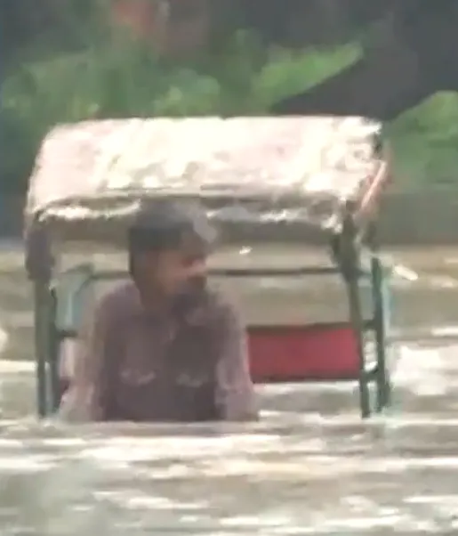 A Rikshaw Puller in Delhi Flood